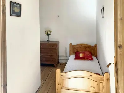 Un ou plusieurs lits dans un hébergement de l'établissement Maison confortable au cœur de Fleurac avec grand jardin