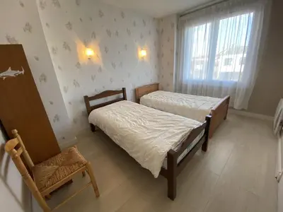 Un ou plusieurs lits dans un hébergement de l'établissement Maison de Ville à Fouras avec Jardin et Garage, Proche Plages - FR-1-709-38