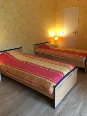 Un ou plusieurs lits dans un hébergement de l'établissement La ferme d'ernest