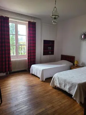 Un ou plusieurs lits dans un hébergement de l'établissement La maison du regisseur