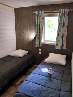 Un ou plusieurs lits dans un hébergement de l'établissement Camping la Venise Verte