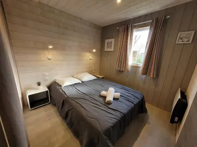 Un ou plusieurs lits dans un hébergement de l'établissement Camping la Venise Verte