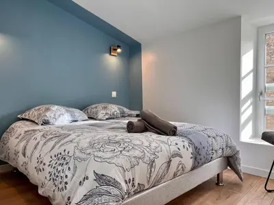 Un ou plusieurs lits dans un hébergement de l'établissement LA PALMERAIE -wifi fibre- centre ville -PROPERTY RENTAL NM