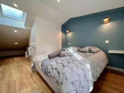 Un ou plusieurs lits dans un hébergement de l'établissement LA PALMERAIE -wifi fibre- centre ville -PROPERTY RENTAL NM