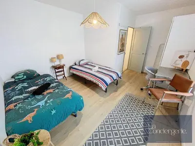 Un ou plusieurs lits dans un hébergement de l'établissement Le Duplex de Bellevue - Futuroscope - La Conciergerie.
