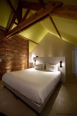 Un ou plusieurs lits dans un hébergement de l'établissement L'authentik petit hôtel, Le Refuge de Mamie Yo