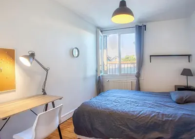 Un ou plusieurs lits dans un hébergement de l'établissement La Pause Douce Cosy à Angoulême - Confort, Lumière et Espace