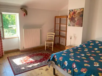 Un ou plusieurs lits dans un hébergement de l'établissement Gite des Noisettes à la porte de Saintes